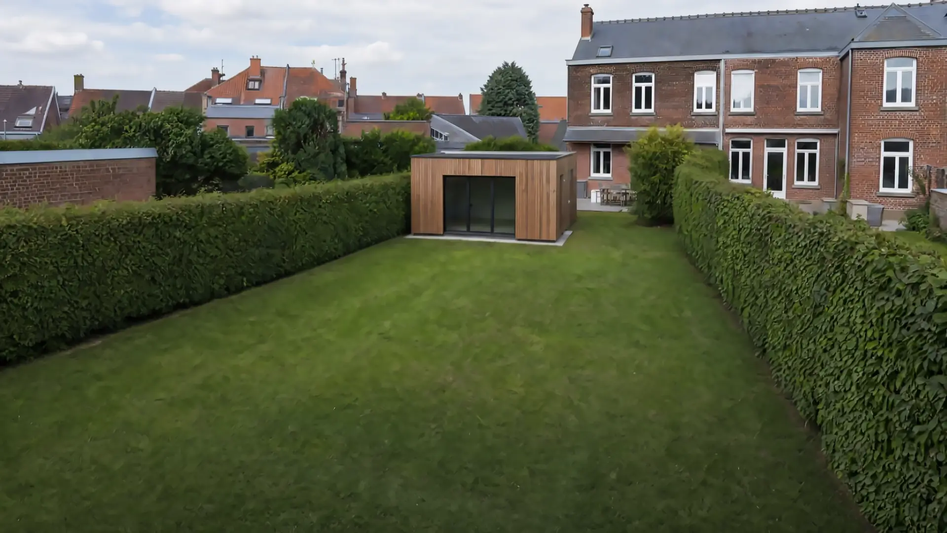 Gently sloping backyard, lawn and hills in the morning light, before construction